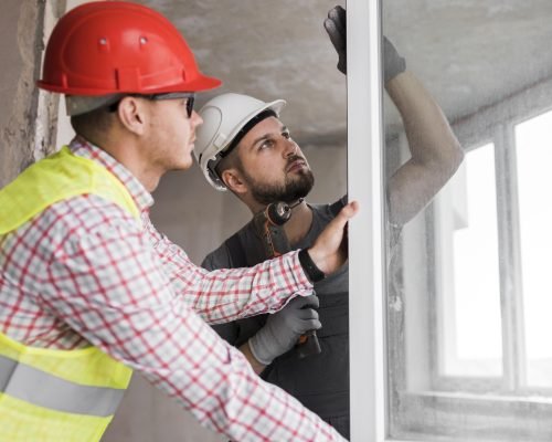medium-shot-man-holding-drill medium-shot-man-holding-drill