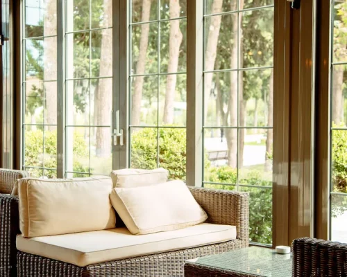 outdoor-sofa-with-beige-cushions-coffee-table-front-restaurant-window_140725-2562 outdoor-sofa-with-beige-cushions-coffee-table-front-restaurant-window_140725-2562